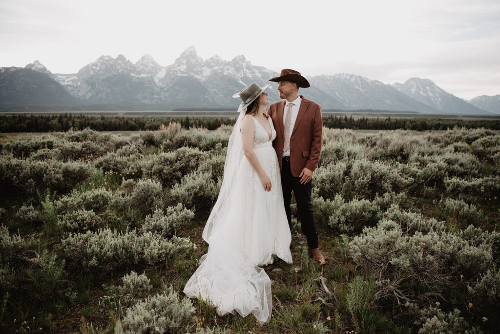 Grand Teton Wedding Photographer captures bride and groom looking at one another 