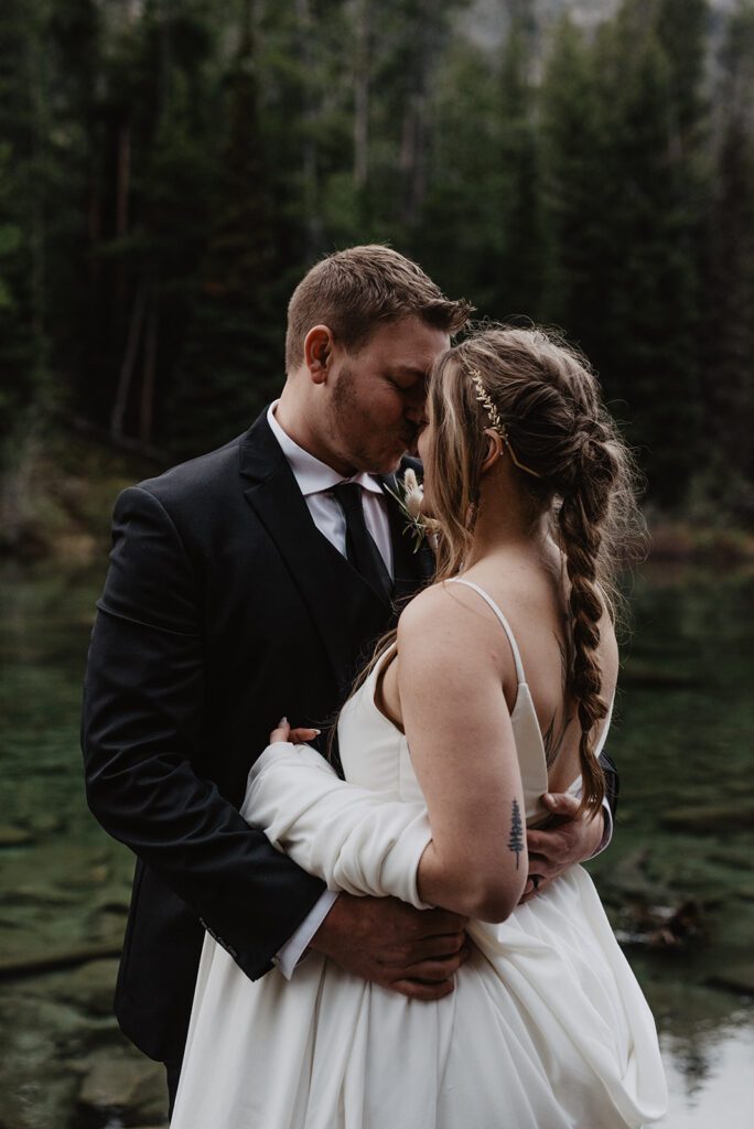 Jackson Hole Elopement Photographer captures bride and groom hugging