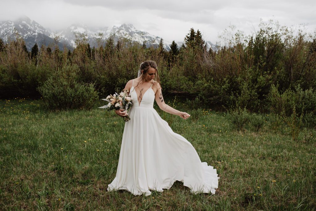 Jackson Hole Elopement Photographer captures bride holding bouquet
