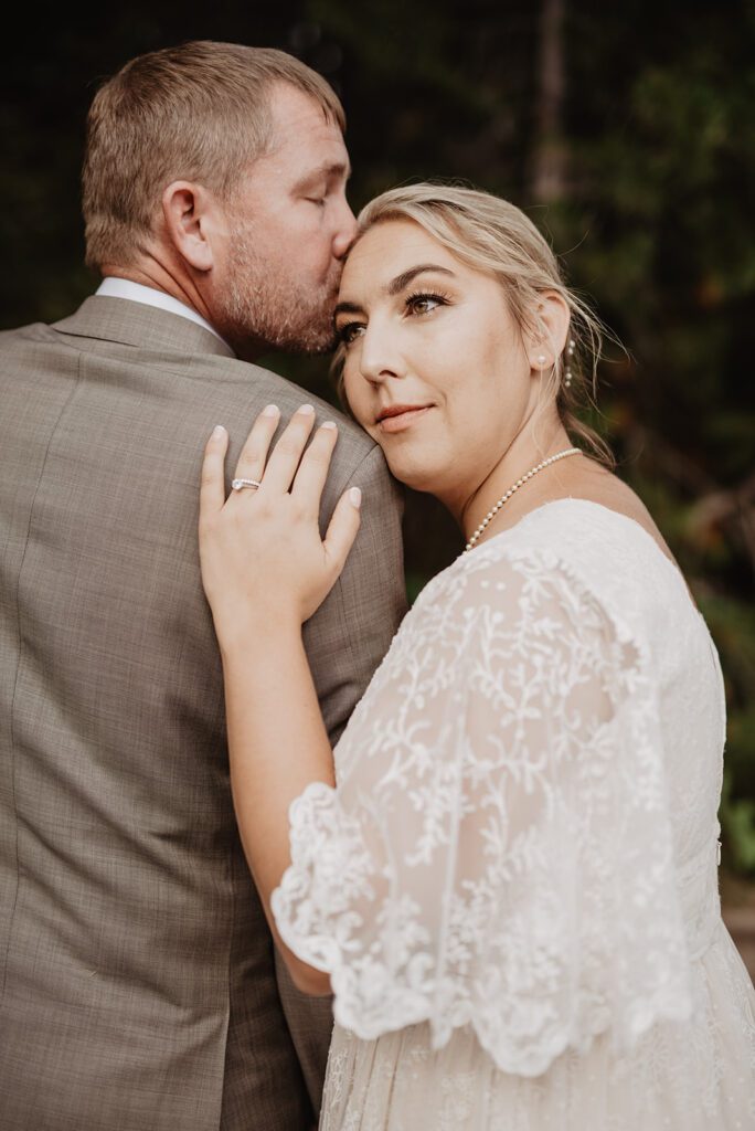 Jackson Hole Elopement Photographer captures bride leaning on groom's shoulder