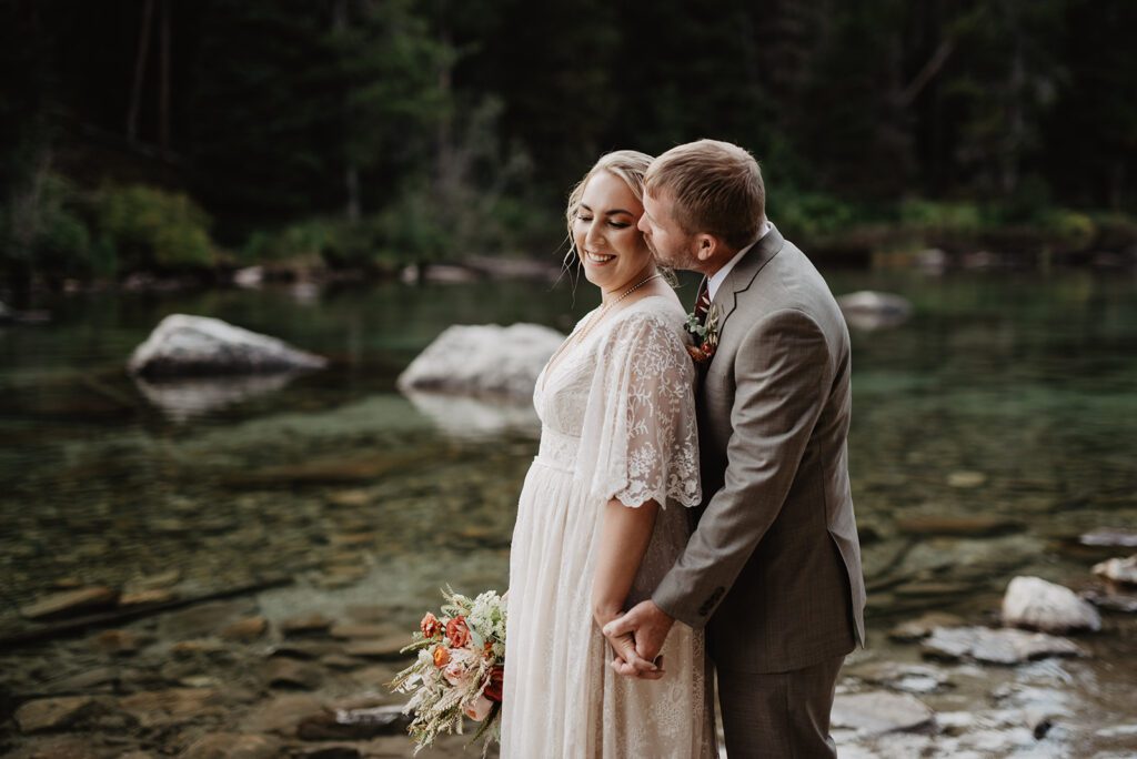 Jackson Hole Elopement Photographer captures groom kissing bride's cheek