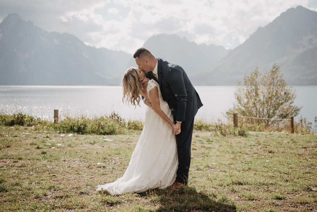 Jackson Hole Photographer captures bride and groom dancing together and kissing
